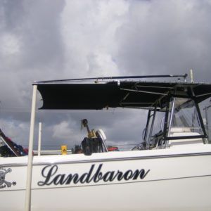 A white boat with the name landbaron on the side