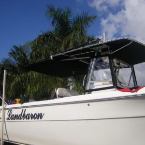 A white boat with the name landbaron on the side