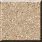 Close-up of a beige speckled stone tile with a light grout edge