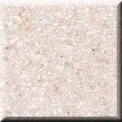 Close-up of a beige speckled stone or tile surface with a beveled edge