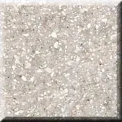 Close-up of a light gray speckled stone or concrete surface with a rough texture