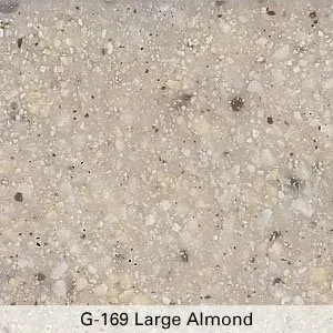 Close-up of light beige speckled granite with a label reading “G-169 Large Almond”