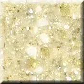 Creamy beige speckled textured surface with white flecks, like polished stone or laminate.