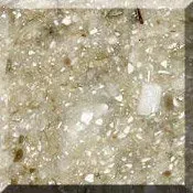 Close-up of a beige, speckled stone or tile surface with a textured finish