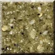 Close-up of speckled green-gray stone or tile surface with black and white flecks