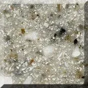 Close-up of speckled gray and white stone surface with small dark and gold flecks