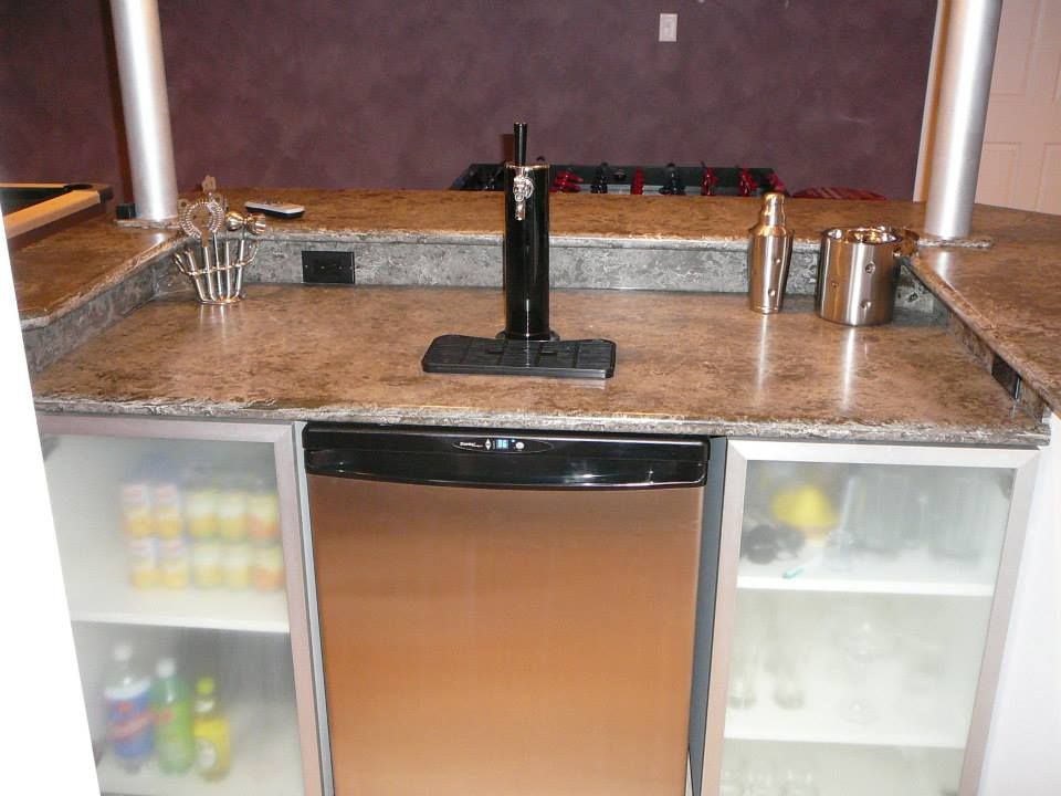 Kitchen sink area with granite countertop, black faucet, stainless dishwasher, and under-cabinet storage cabinets