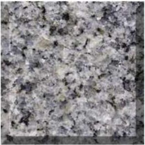 Close-up of speckled gray granite stone texture with black and white flecks