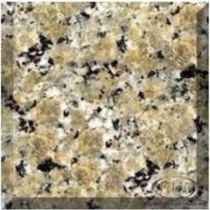 Close-up of beige and gray speckled granite countertop surface