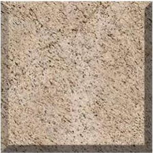 Close-up of a beige speckled stone or tile surface with a dark border