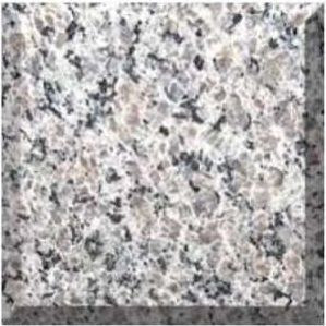 Close-up of speckled gray and white stone or granite surface