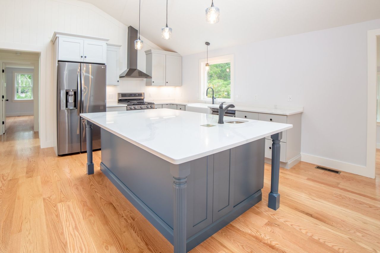 There is a large island in the middle of the kitchen.