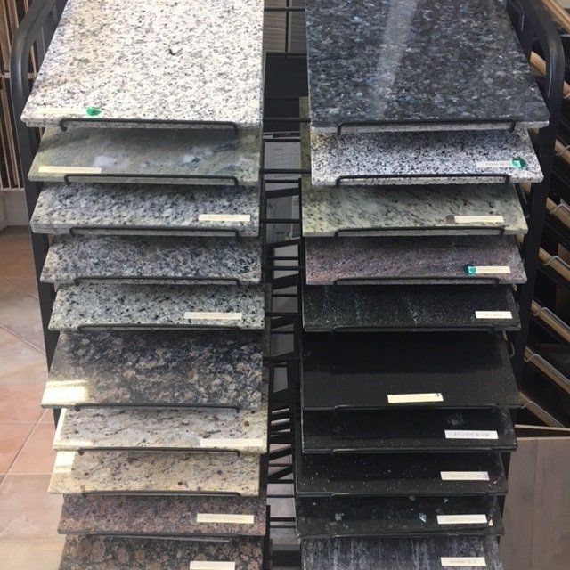 A display of granite tiles of different colors