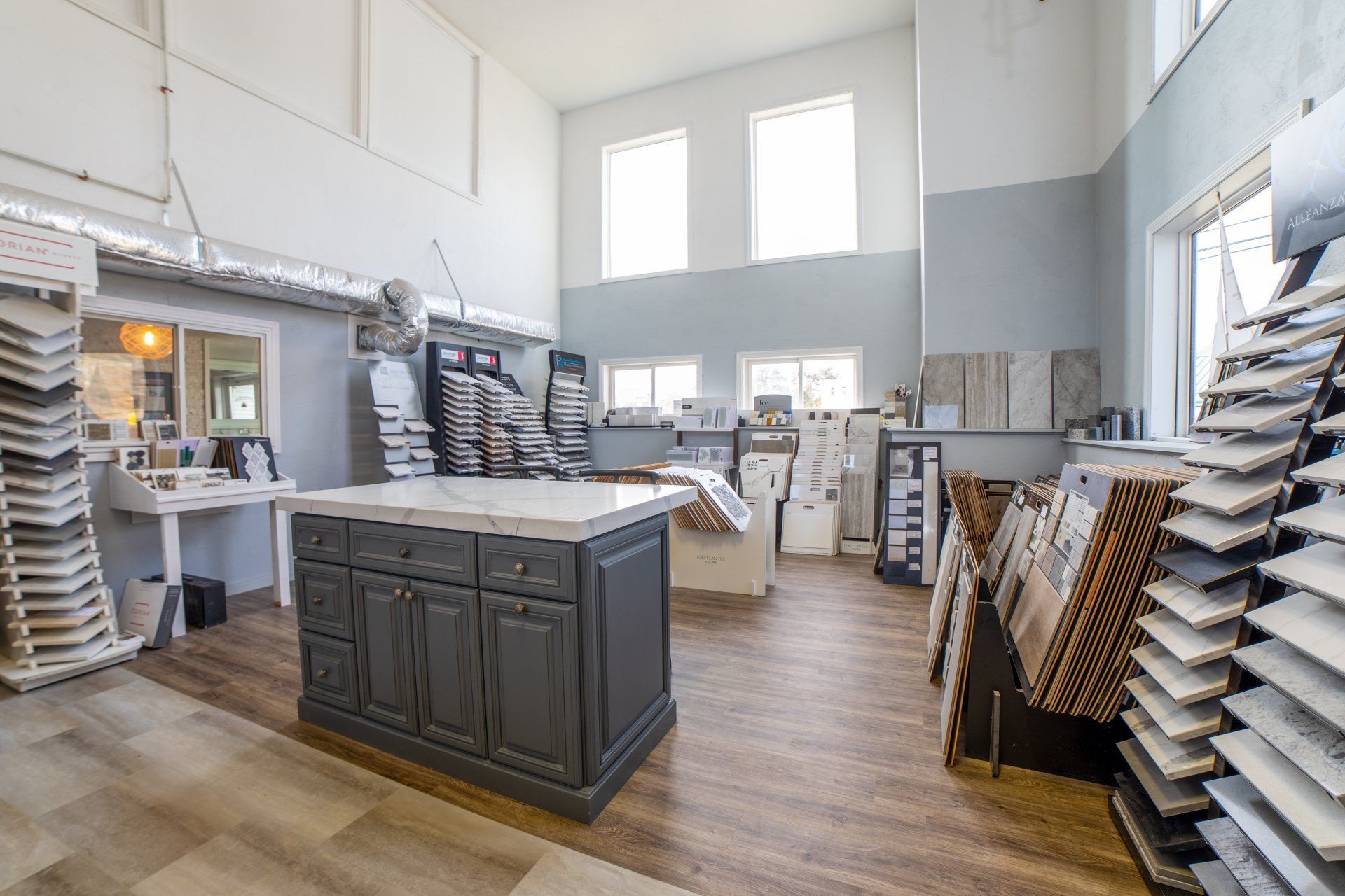 A kitchen with a large island in the middle of the room.