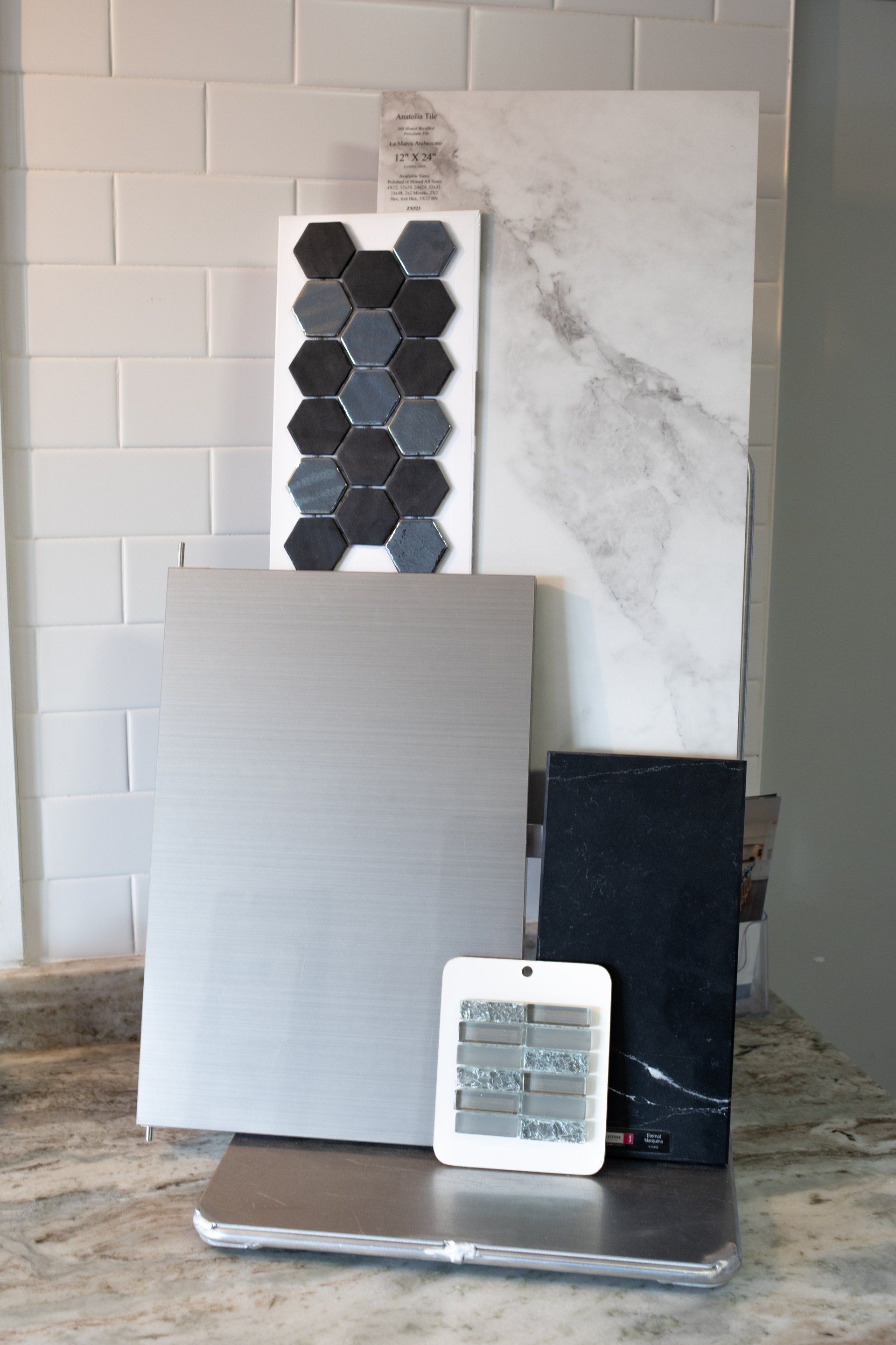 A display of tiles and a clock on a counter