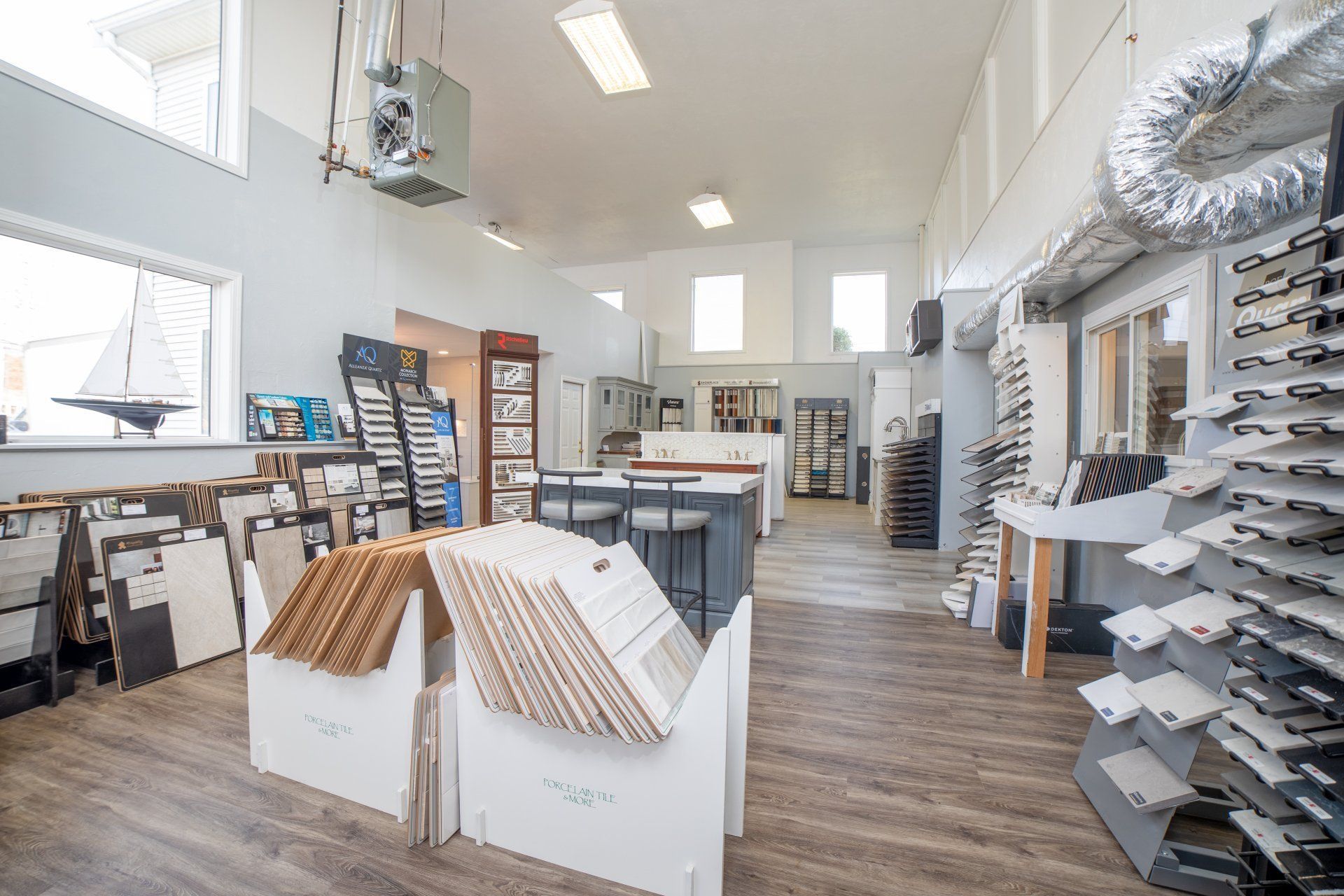A large room filled with lots of furniture and tiles.