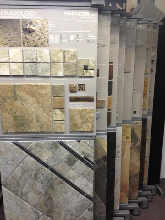 A display of tiles with a sign that says archaeology