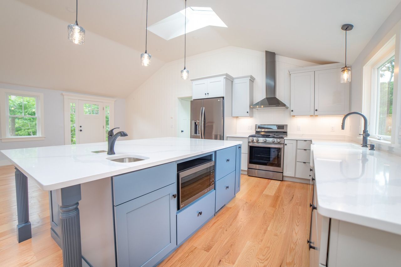 There is a large island in the middle of the kitchen.