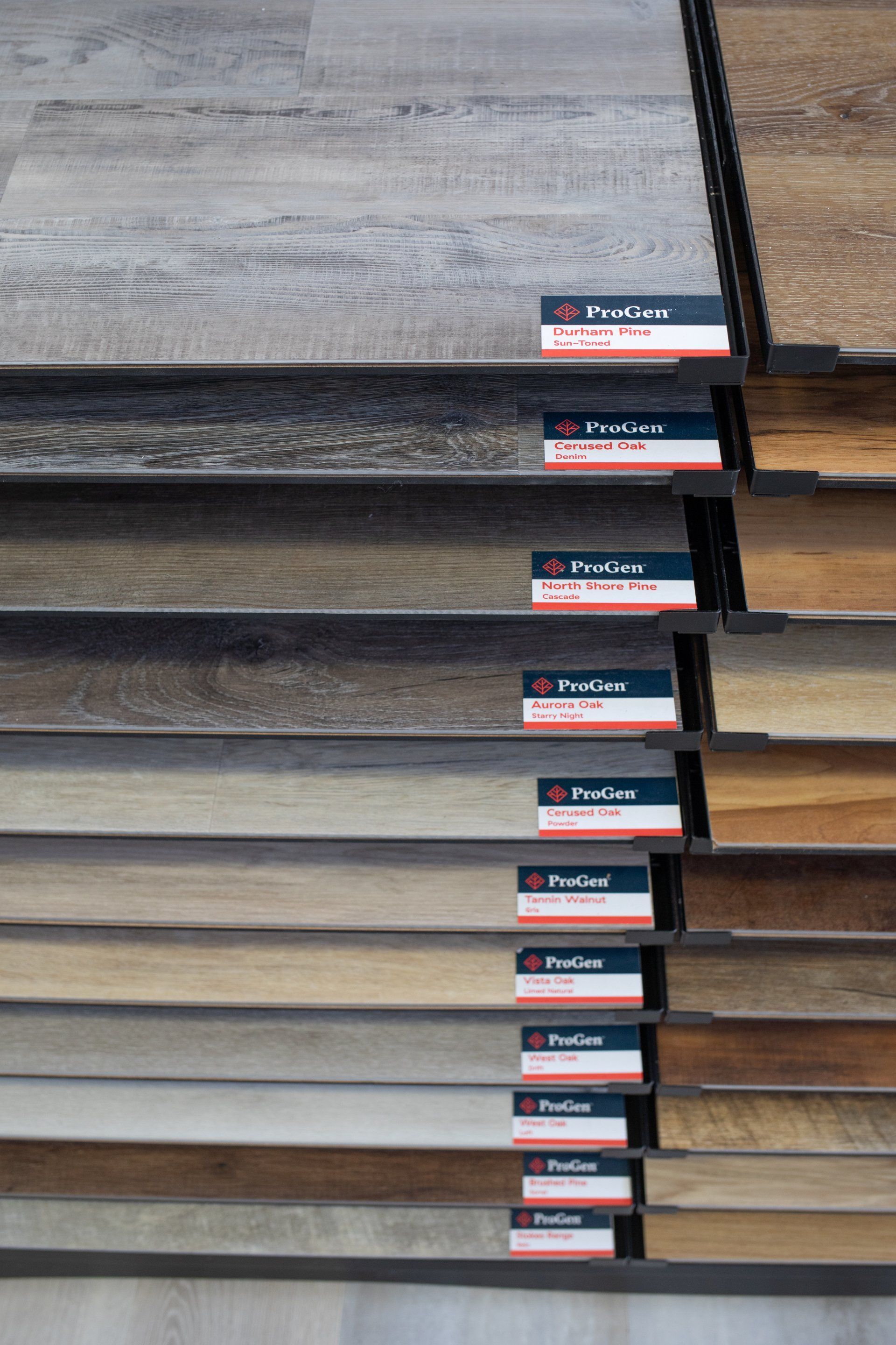 A display of different types of hardwood flooring in a store.