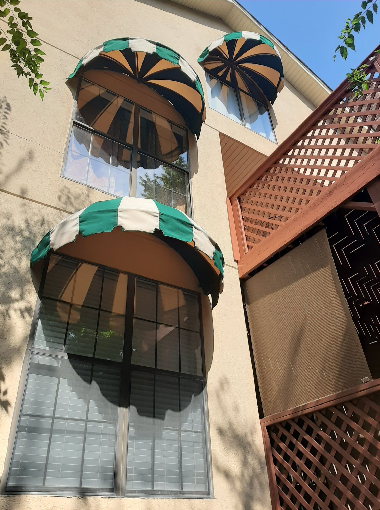 A building with a lot of windows and awnings on them