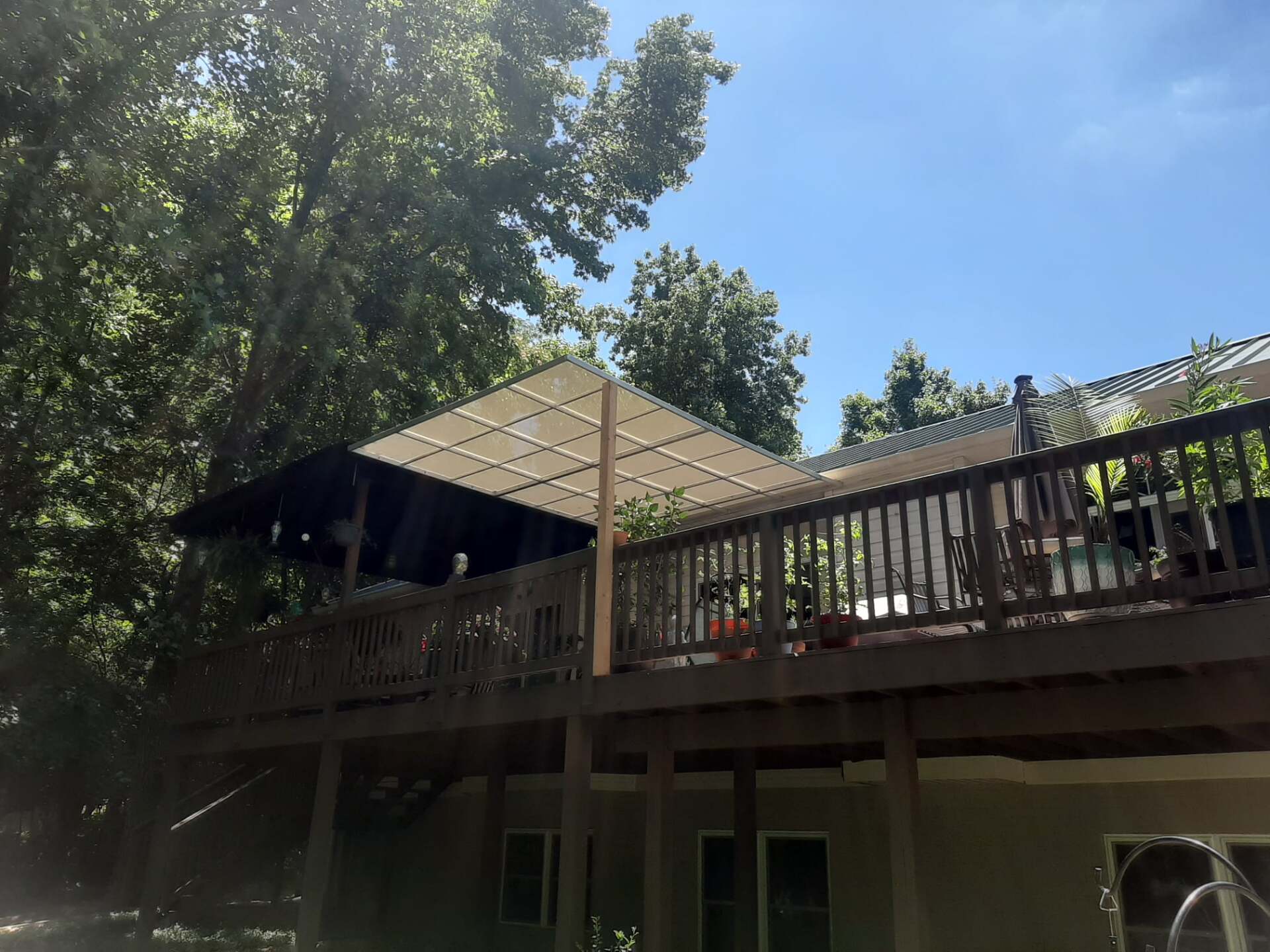 A large deck with a canopy on top of it