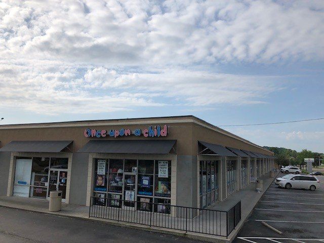 A building with a sign that says once upon a child