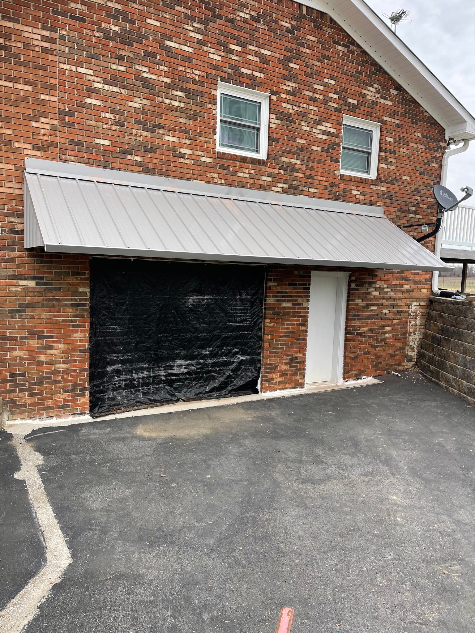 brick wall with gray awning