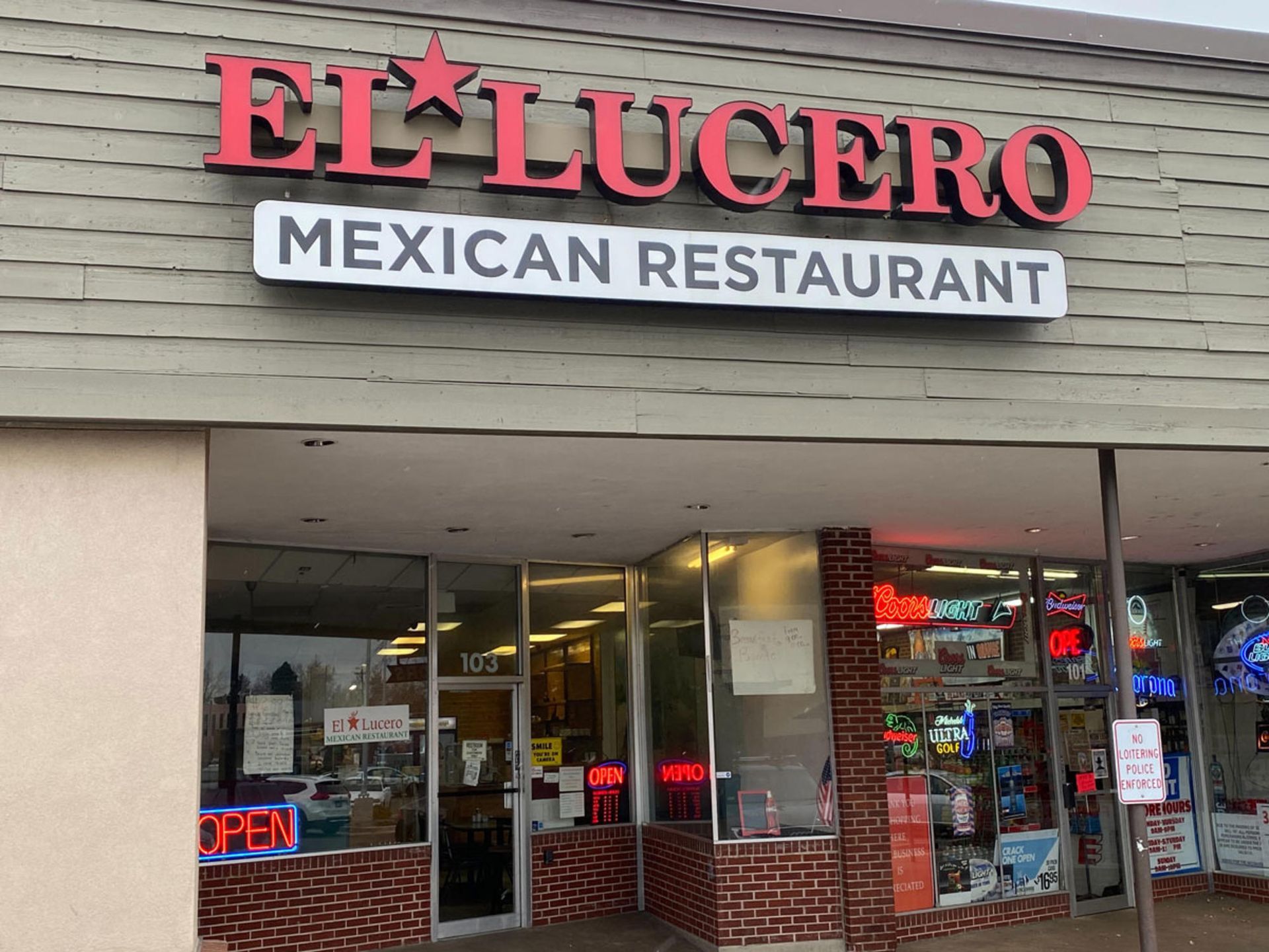 El Lucero Mexican Restaurant storefront with red sign, white text, and brick accents.