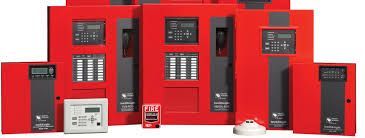 Red fire alarm control panels and emergency devices displayed in a row on a white background