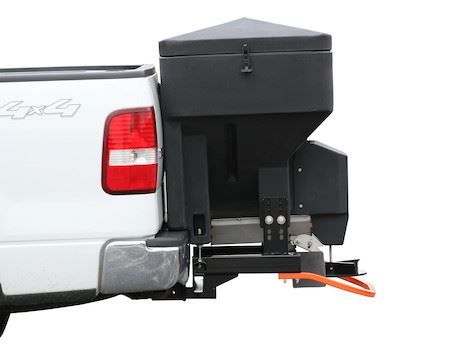 A white truck with a black box attached to the back of it