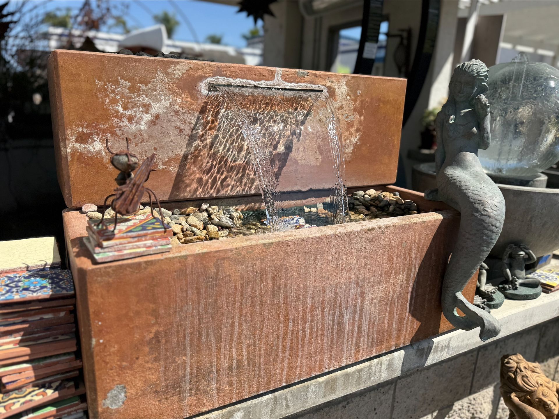 A fountain is sitting inside of a wooden box.