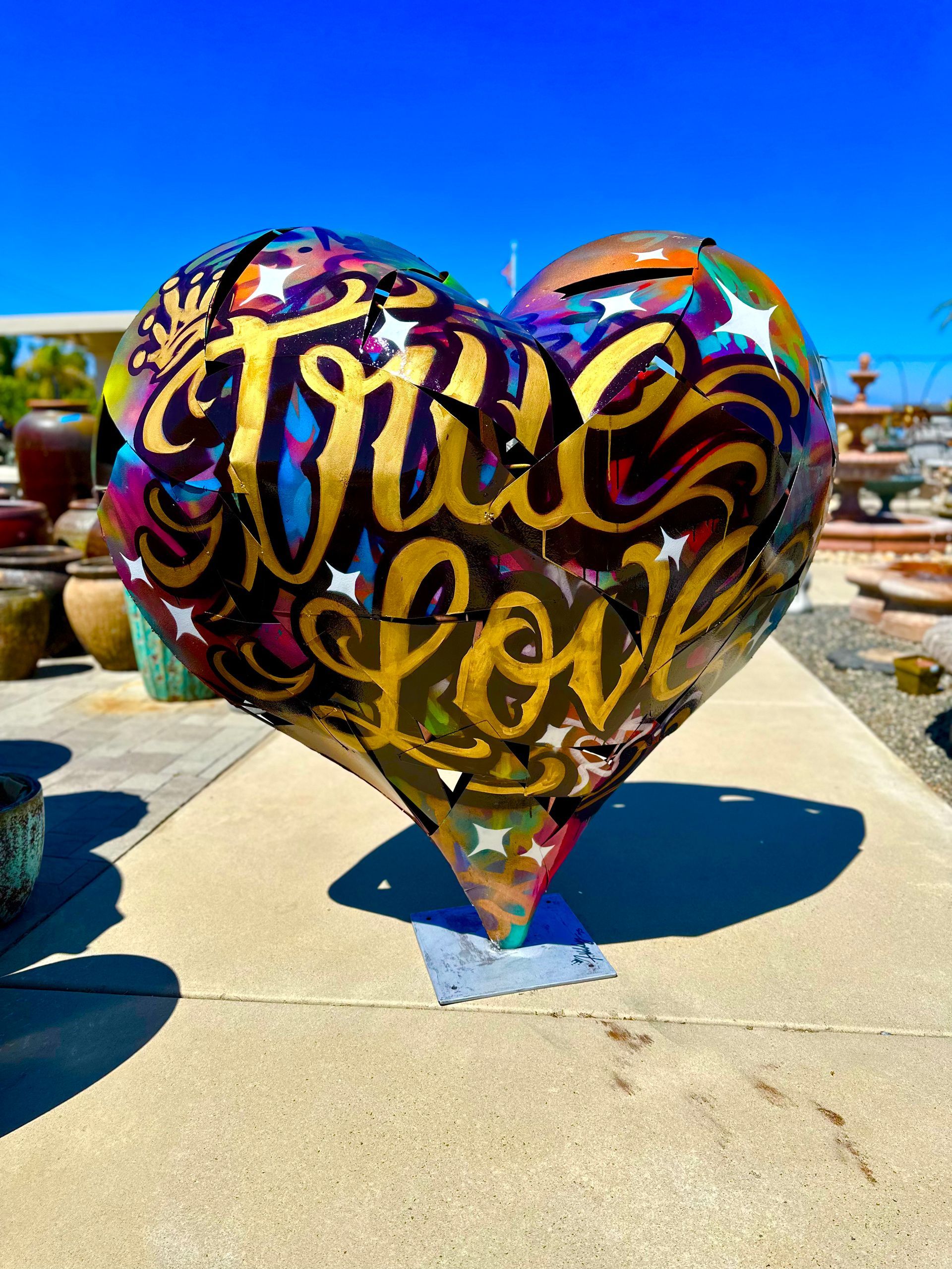 A colorful heart with the words true love on it