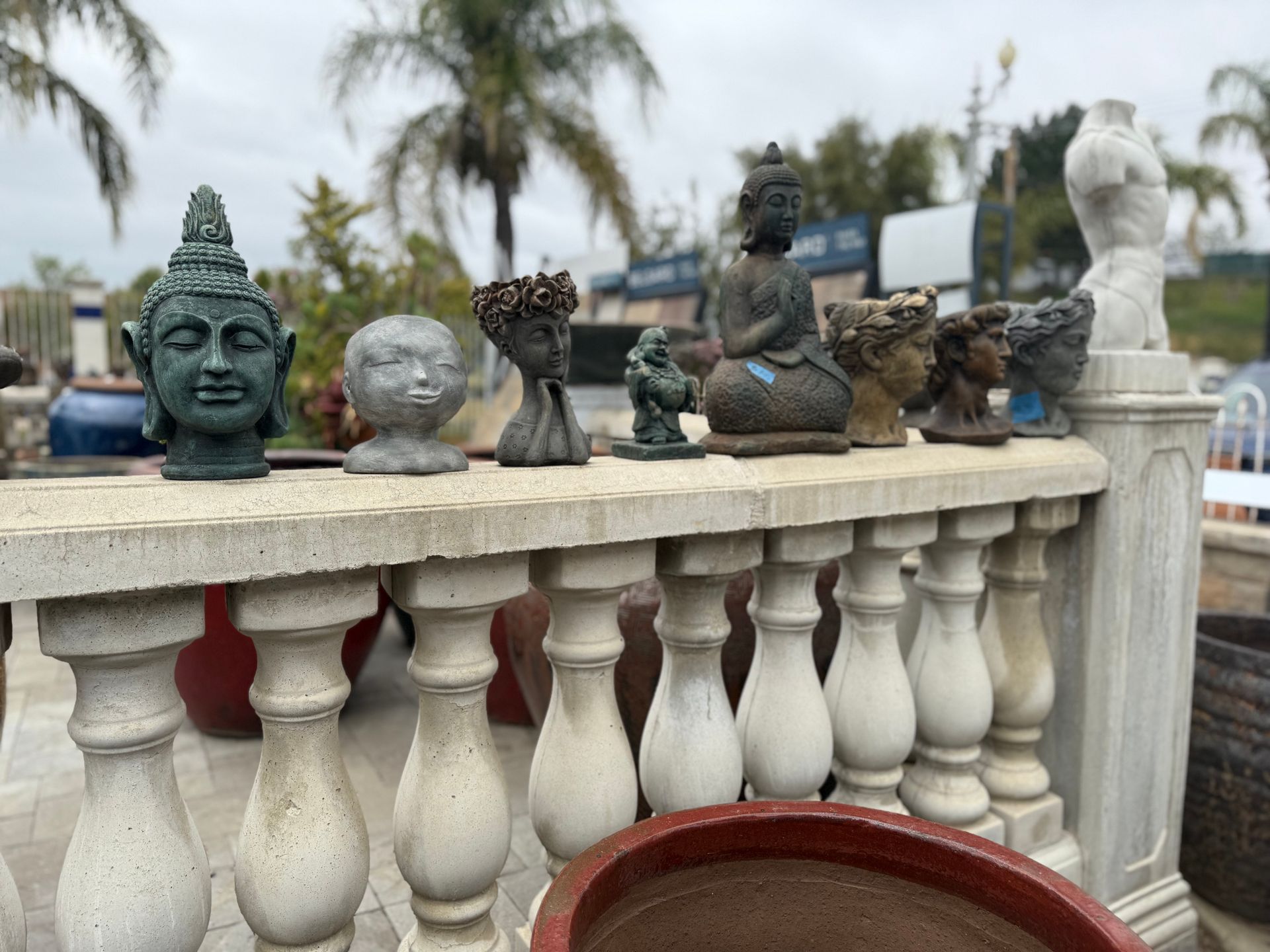 A fence with a bunch of statues on it