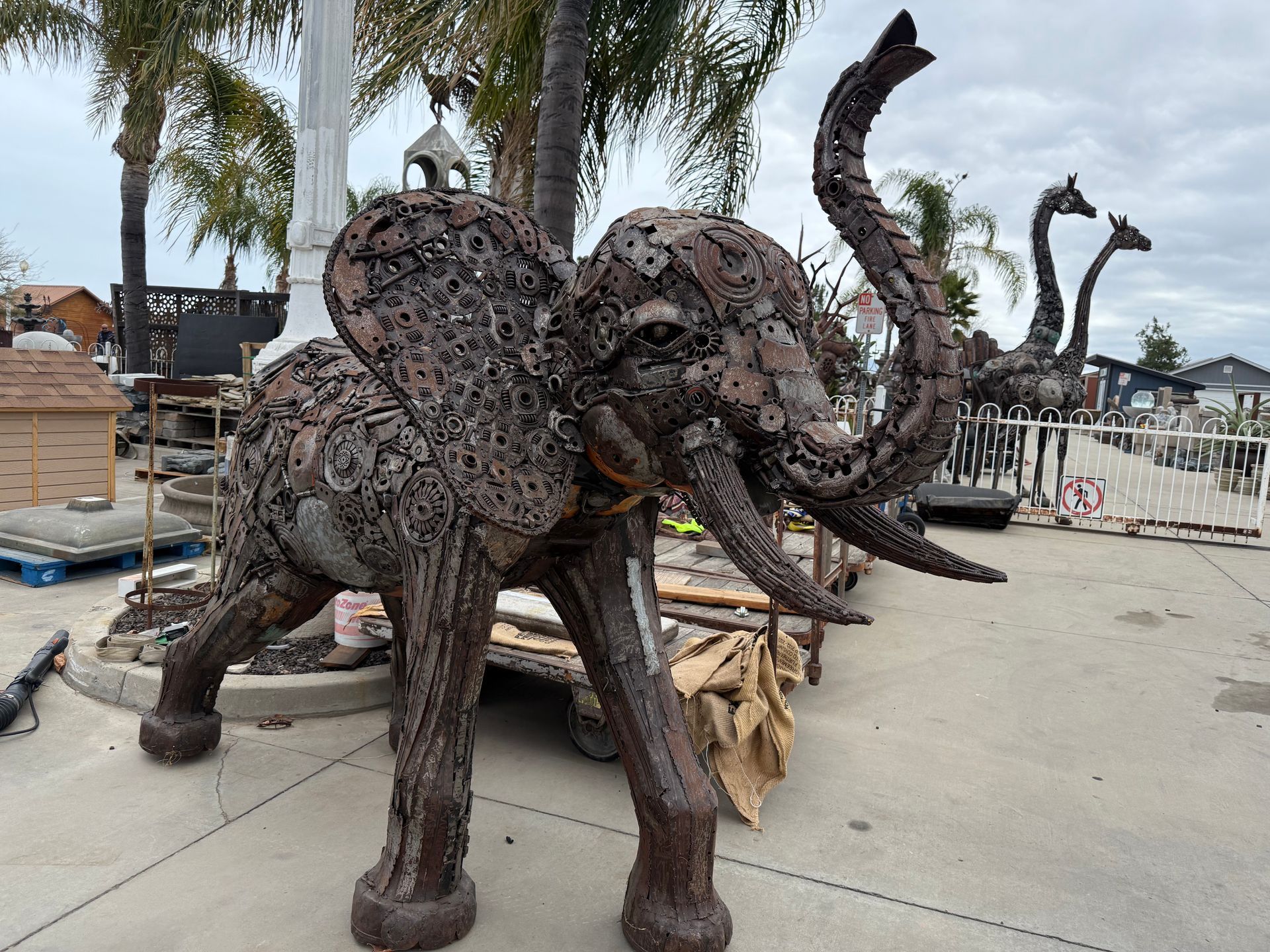 A statue of an elephant made out of nuts and bolts