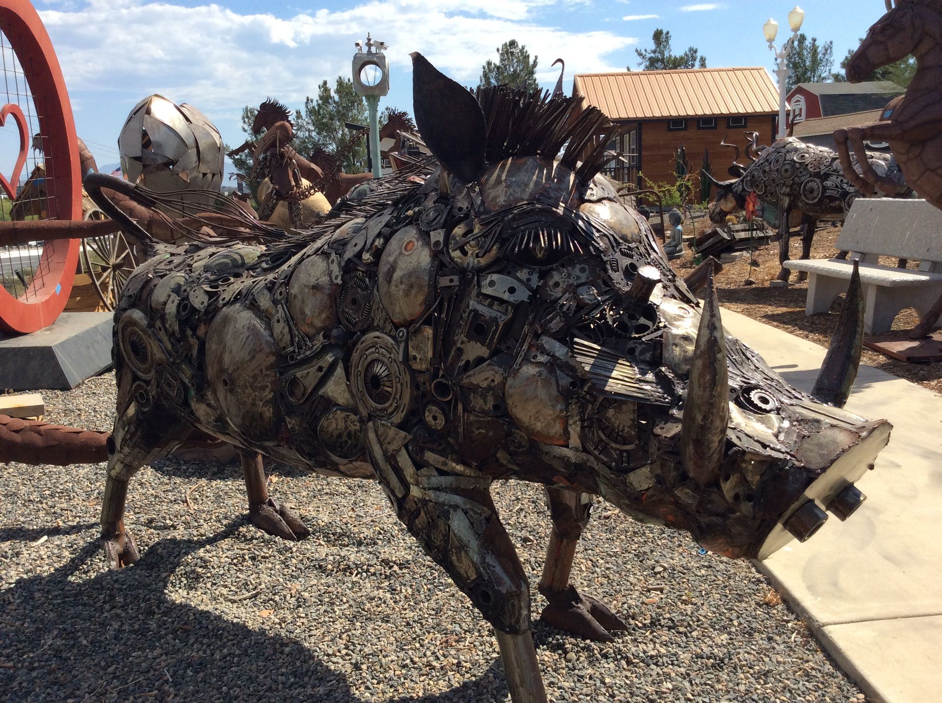 A sculpture of a boar made out of junk