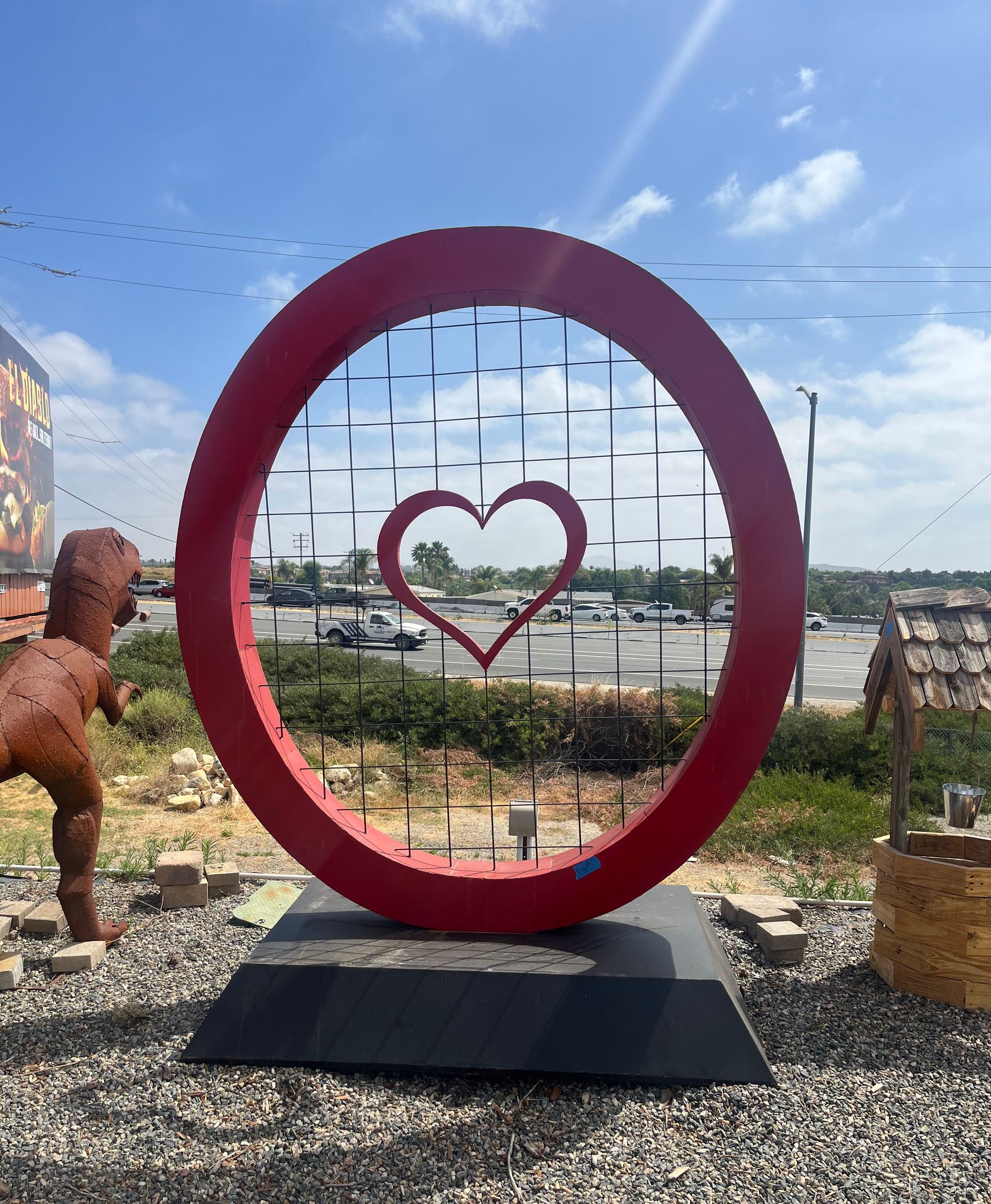 A red circle with a heart in the middle of it