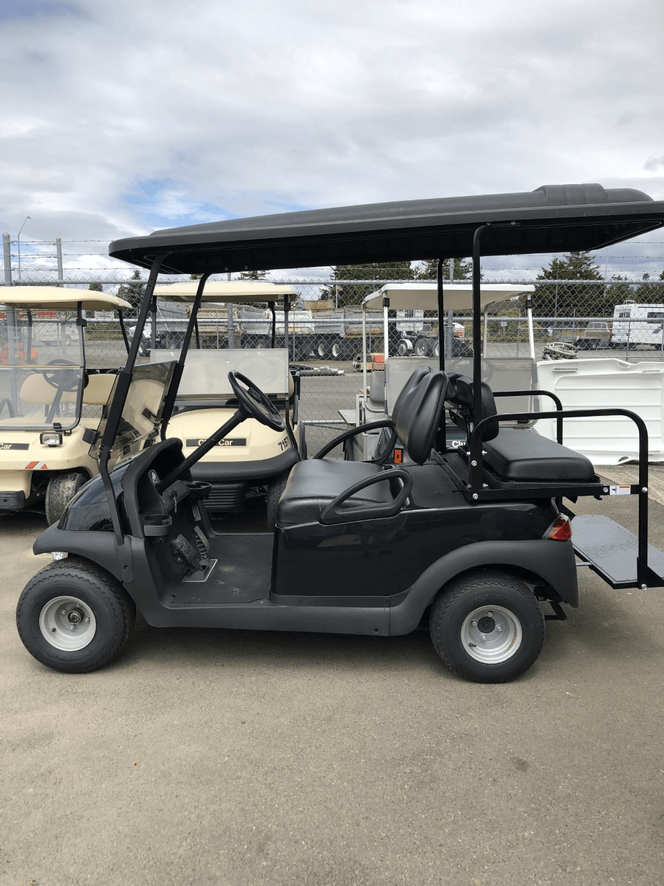 White golf cart with blue enclosure