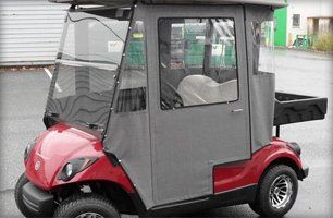 Red golf cart with enclosure