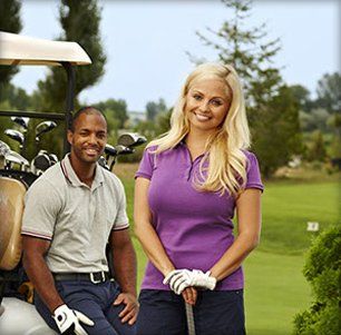 Female and male golfers