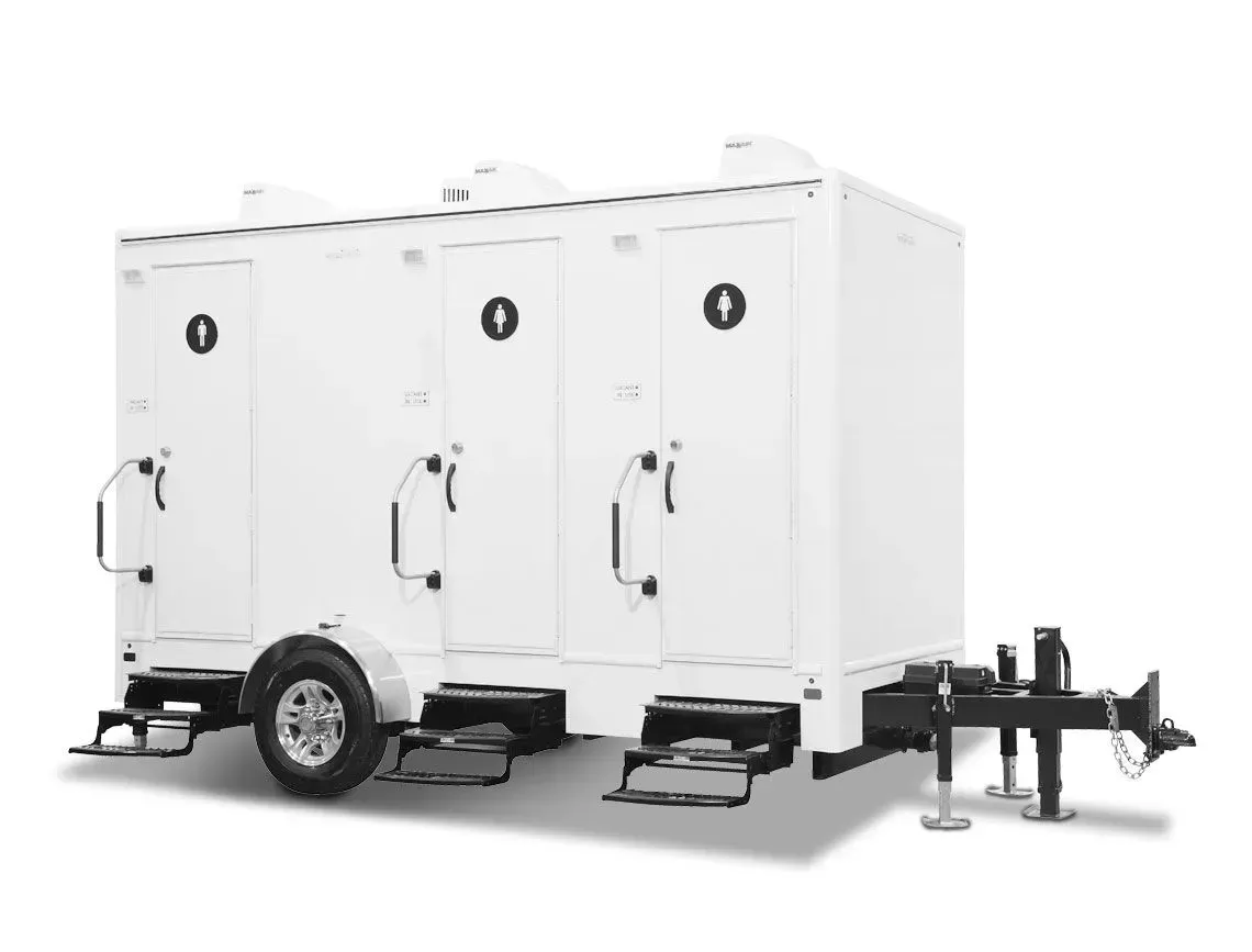 White enclosed trailer with three cargo compartments and a hitch on a plain background
