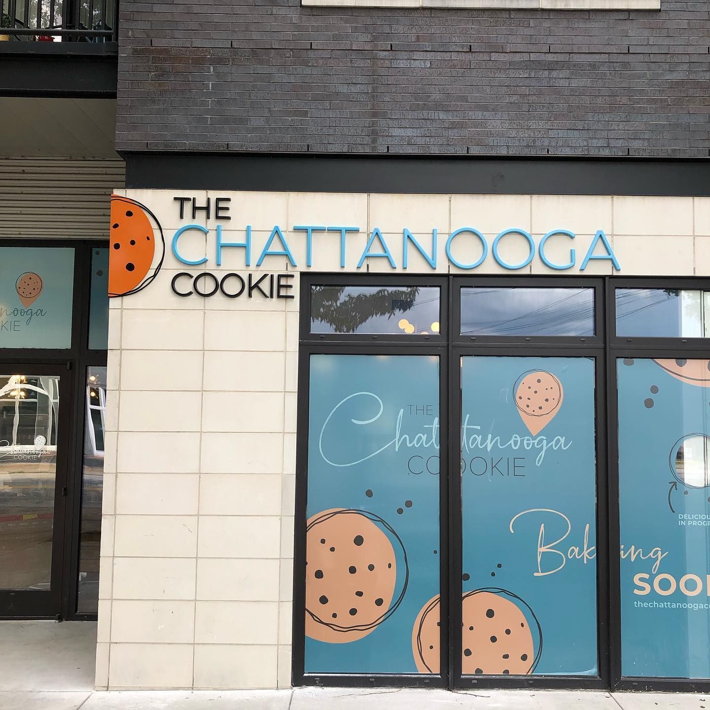 The Chattanooga Cookie storefront with sign and window decals featuring cookies.