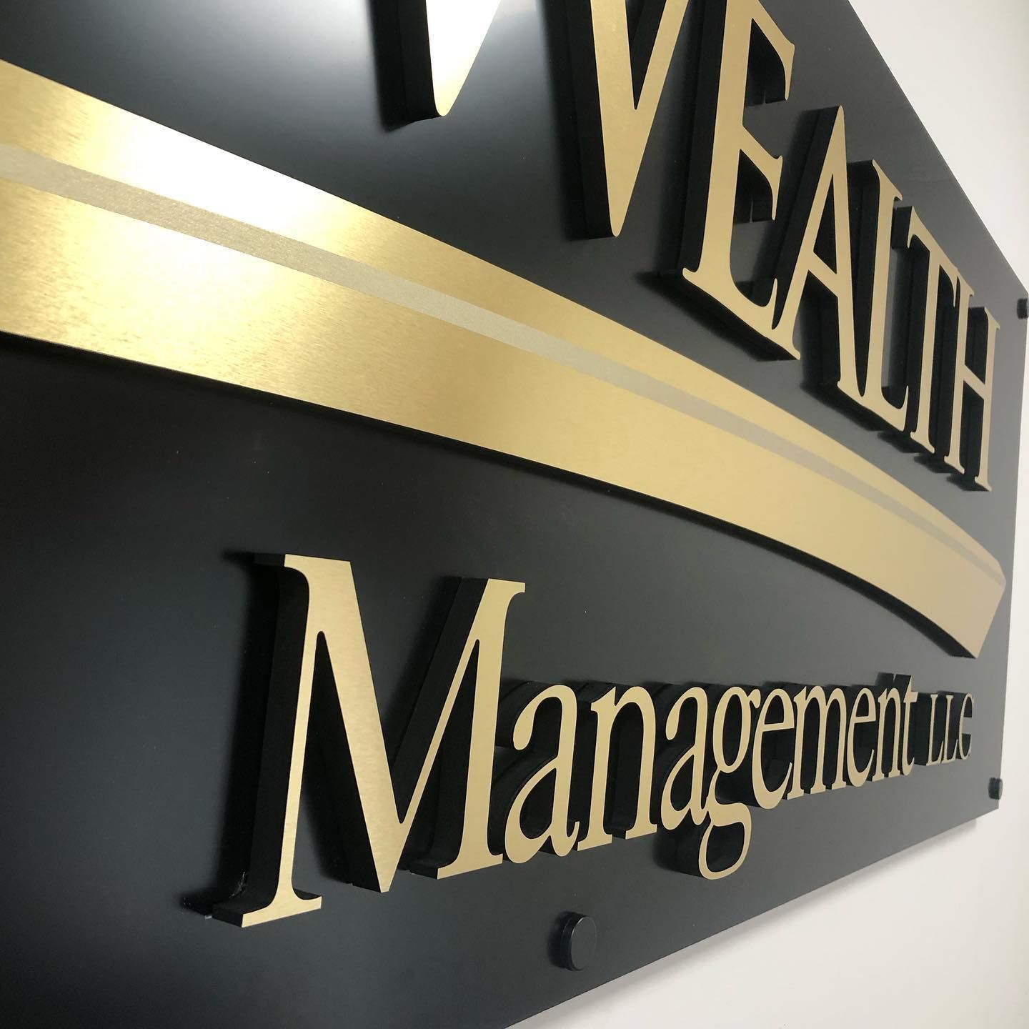 Black and gold sign for 