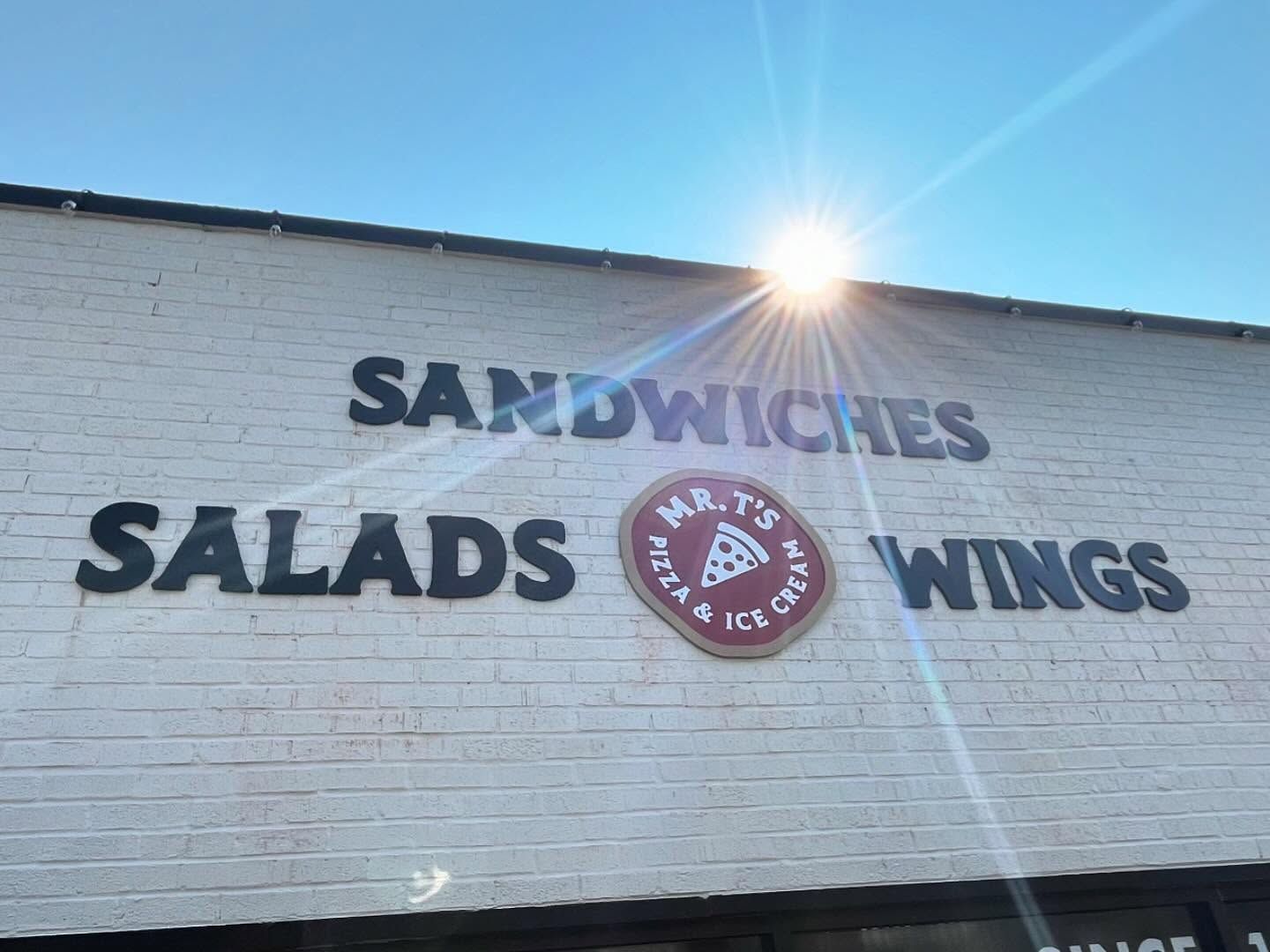 Sign for Mr. T's, a restaurant. Features 