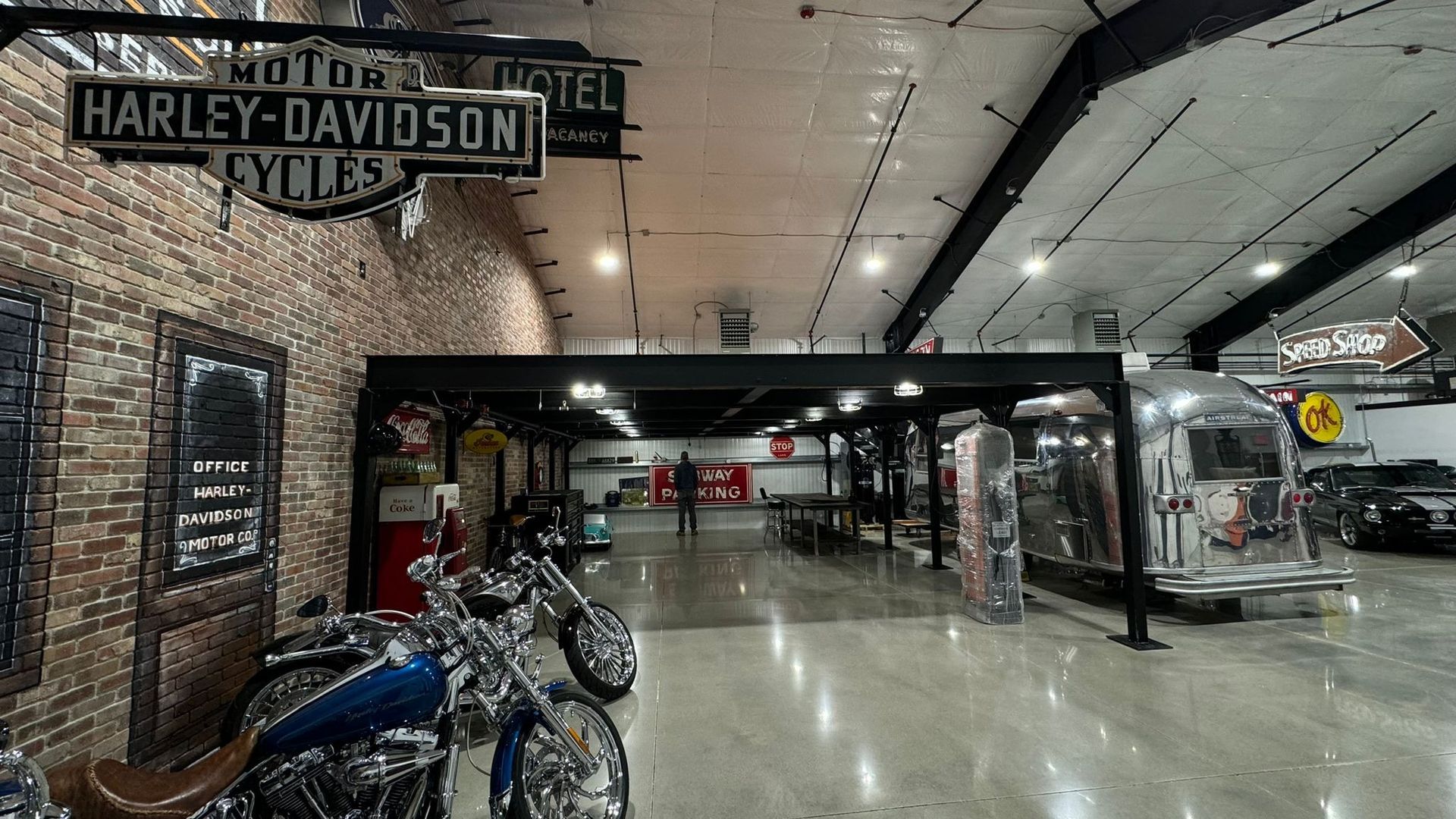 Harley-Davidson showroom with motorcycles, polished floor, and a brick-accented interior.