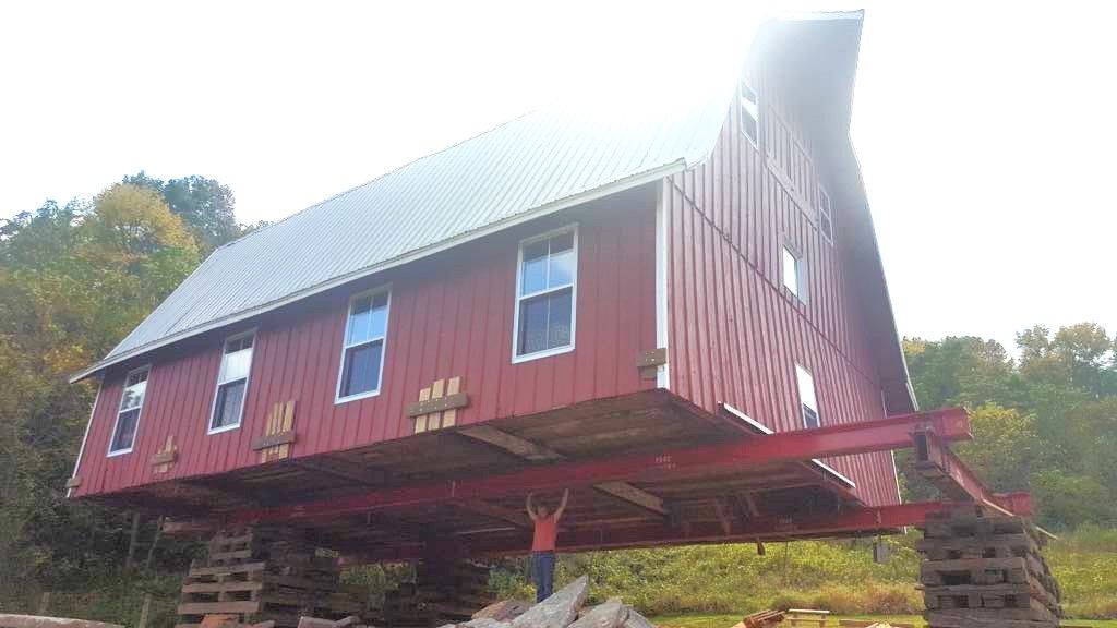 man that looks like he is lifting a structure