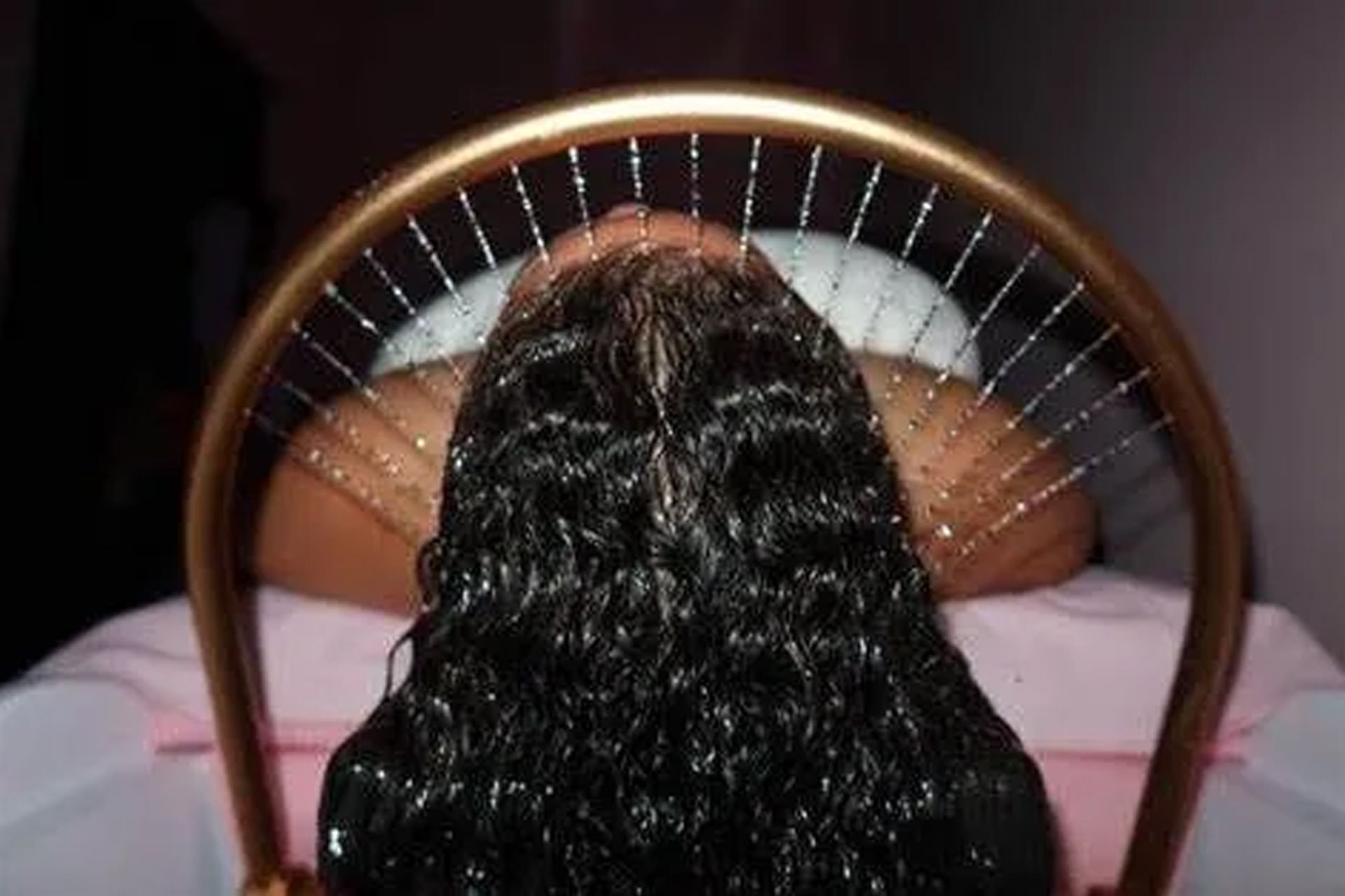 Woman receiving head and scalp facial