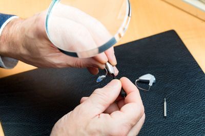 A pair of hearing aids are sitting on a table.