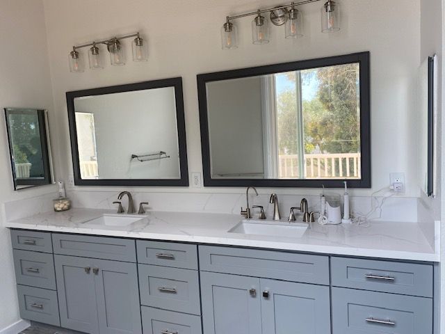 Bathroom with two sinks and two mirrors