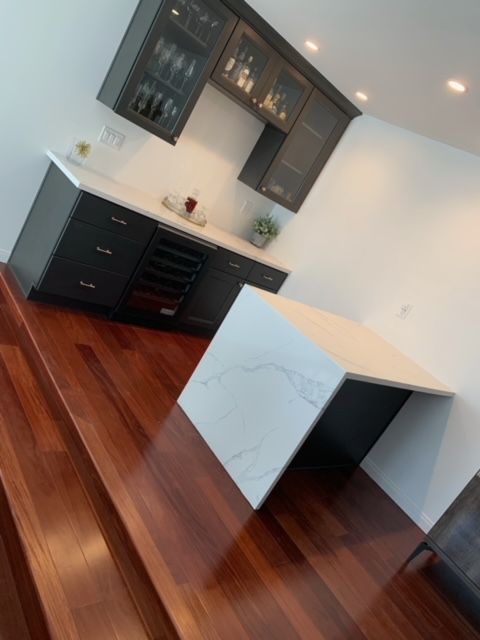 A kitchen with a large island in the middle