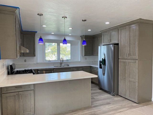 A kitchen with appliances and cabinets